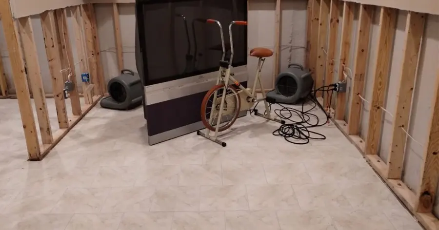 Air movers along opened walls during a Punta Gorda water damage dry-out
