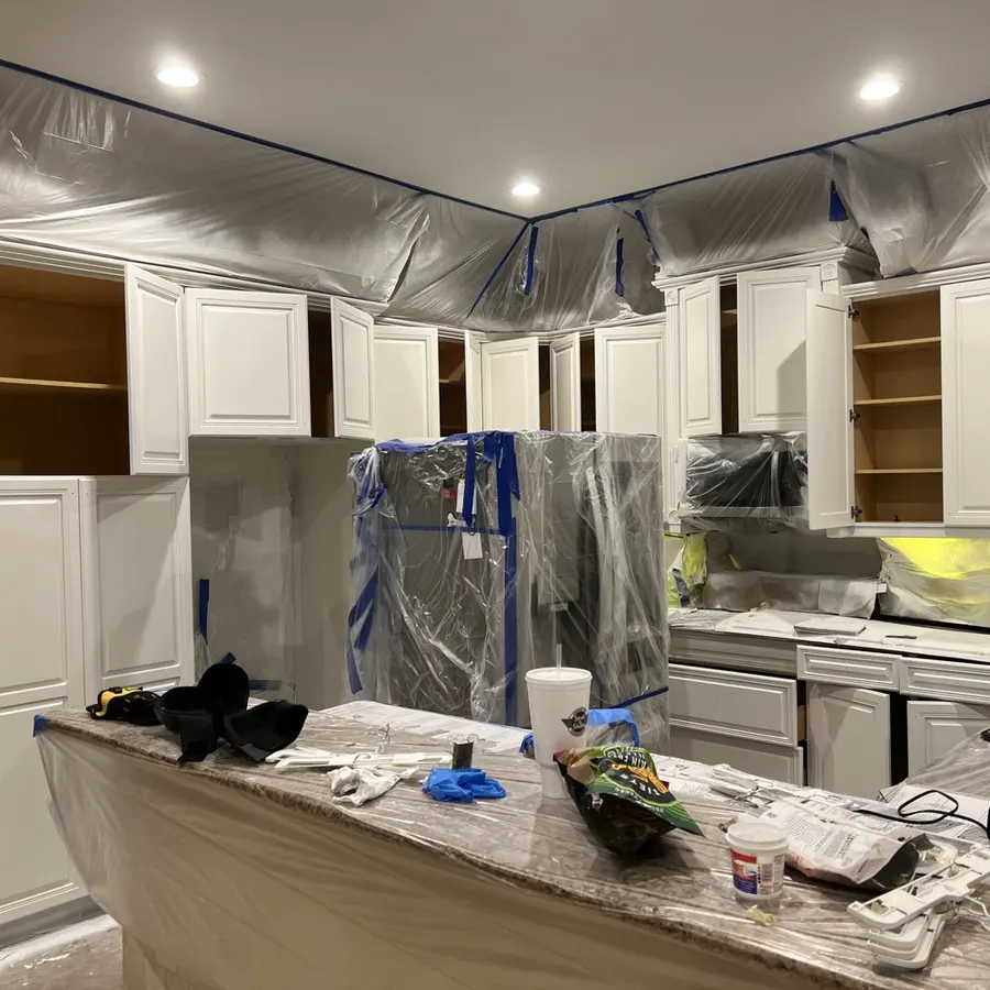 Kitchen wrapped in plastic containment during water damage cleanup in Punta Gorda, FL